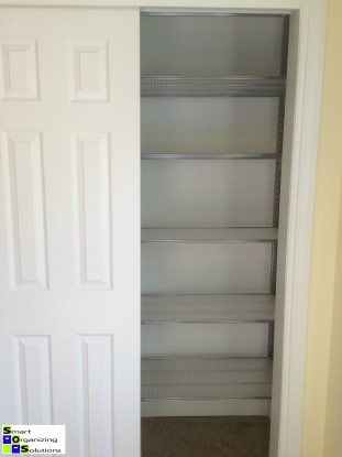 Empty closet with Elfa shelves