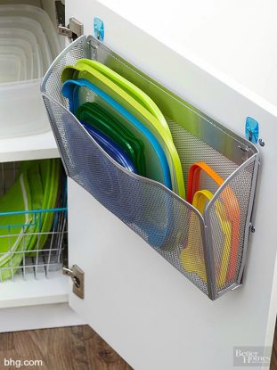 Loose tupperware lids on back of kitchen cabinet door