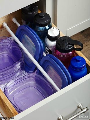 Tension Rods holding lids and food storage containers in kitchen drawer