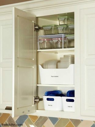 Food storage containers organized nicely in kitchen cabinet