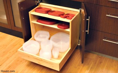 Food storage containers organized in a kitchen with pull outs