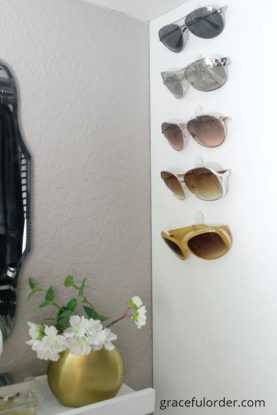 Sunglasses on Command hooks for closet organization