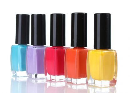 Group of bright nail polishes isolated on white