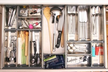 Kitchen utensils drawer full by various tools