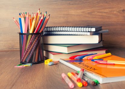 School supplies on wooden background. Back to school concept