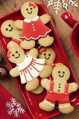 Gingerbread people on a red plate